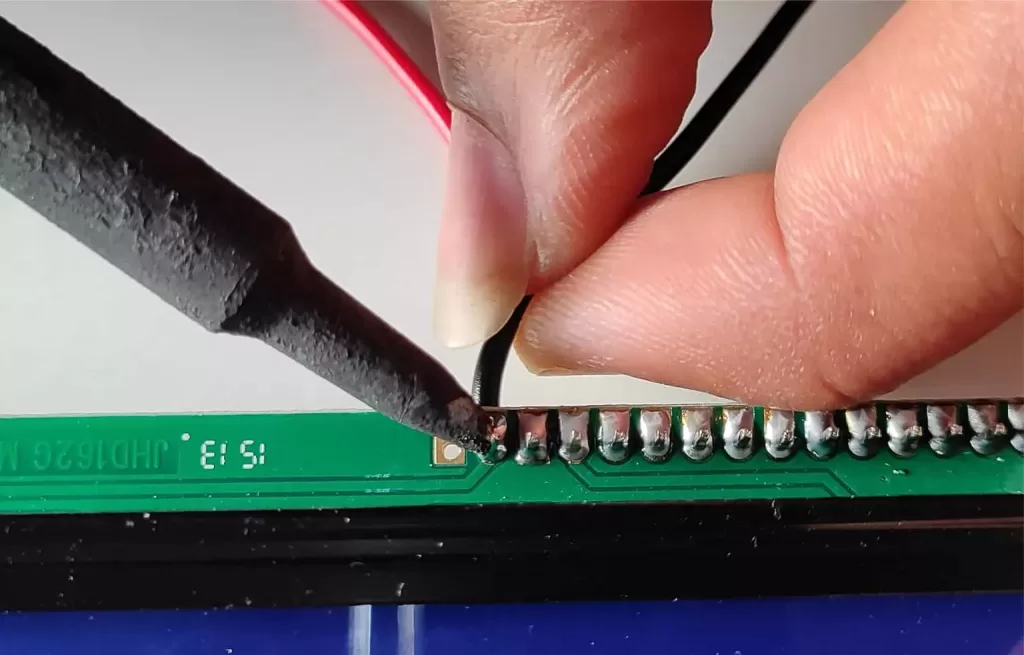soldering black wire to big LCD pin